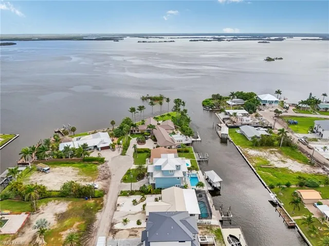 Aerial perspective of suburban area with a large body of water