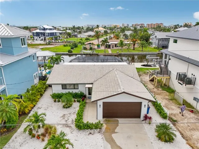 Aerial view of residential area with a nearby body of water