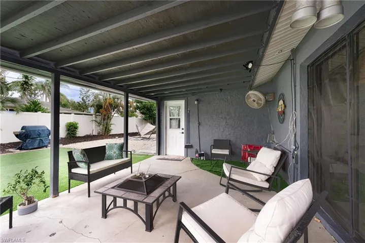 View of patio with an outdoor hangout area