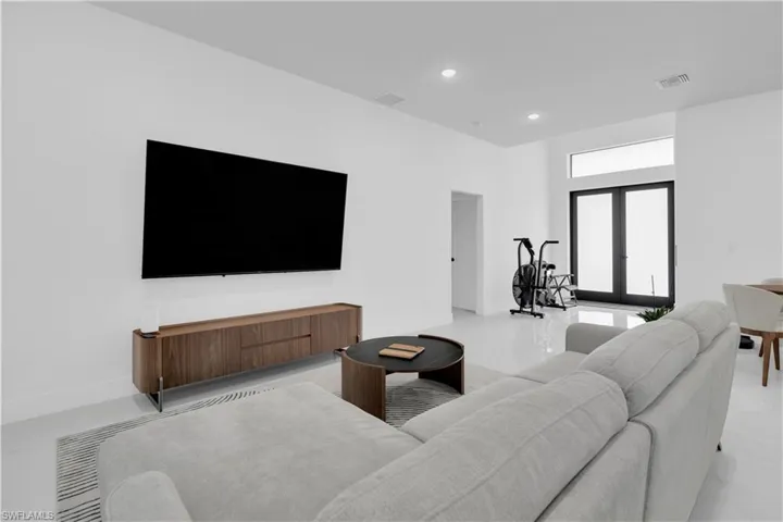 Living area with recessed lighting and french doors