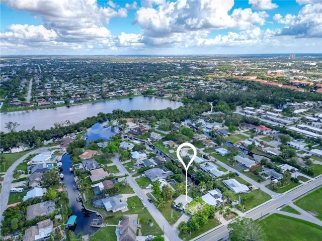 Aerial view of property's location featuring nearby suburban area