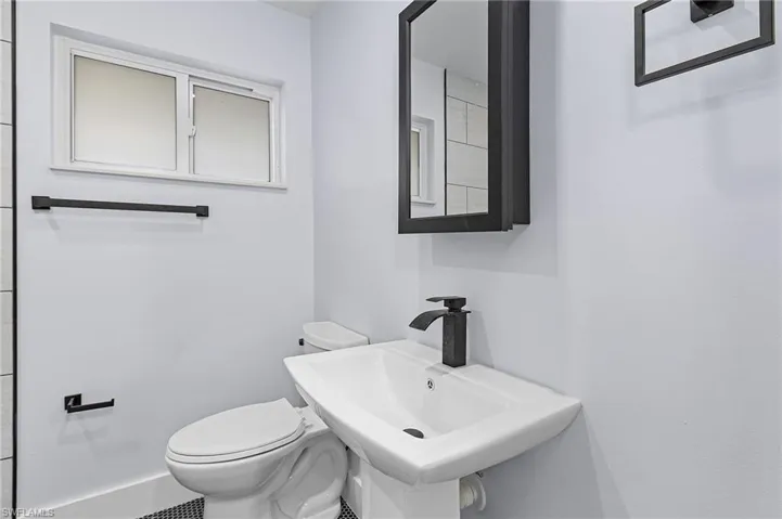 Bathroom featuring a sink and toilet