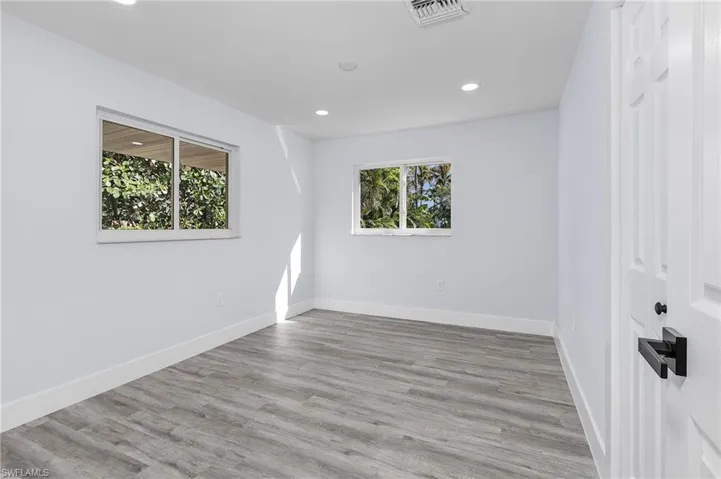 Spare room with recessed lighting and wood finished floors