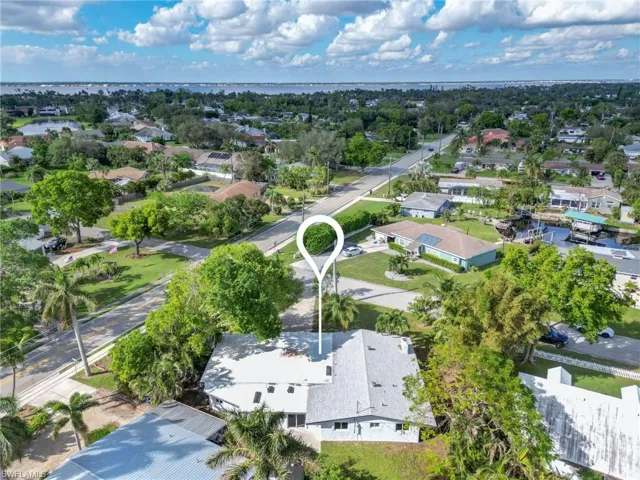 View of property location with nearby suburban area