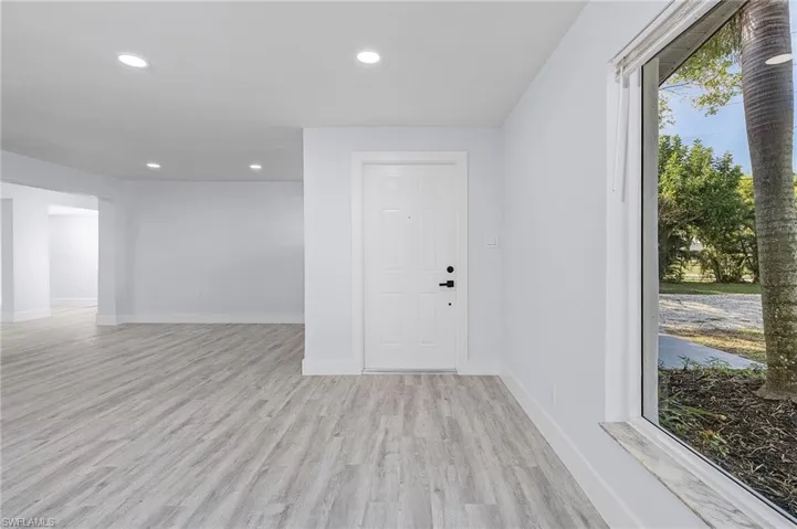 Spare room featuring light wood-style floors and recessed lighting