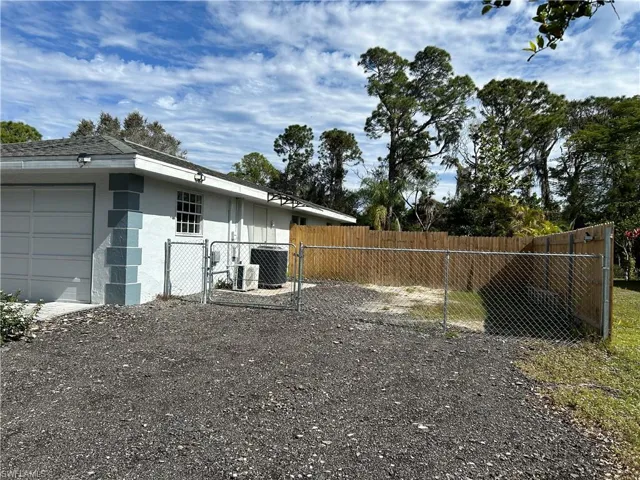 View of yard with a garage