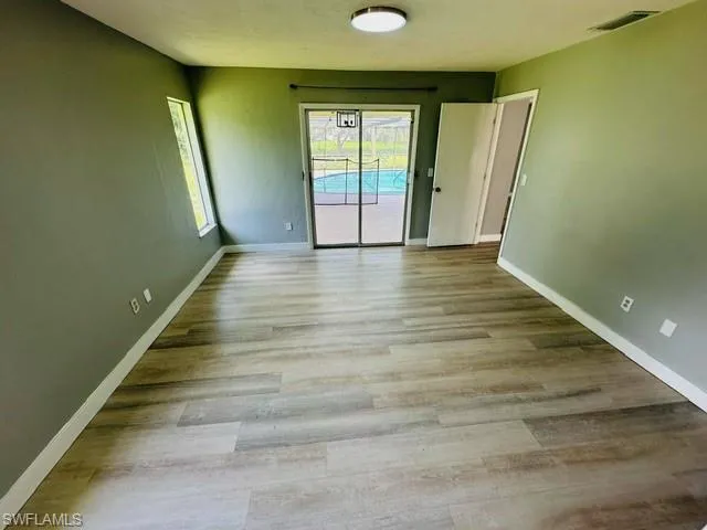 Spare room with light hardwood / wood-style flooring