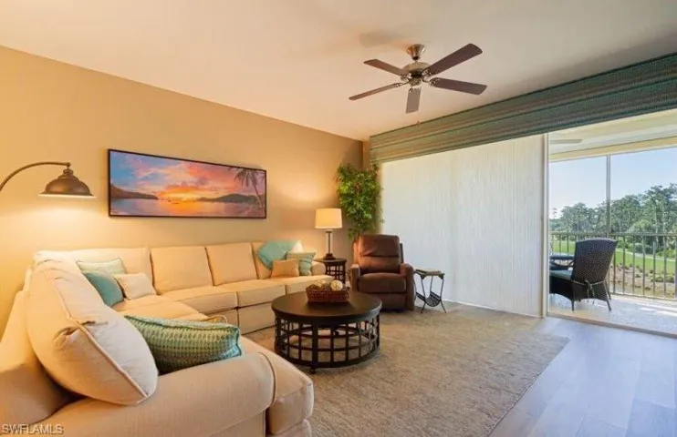 Living area featuring wood finished floors and ceiling fan