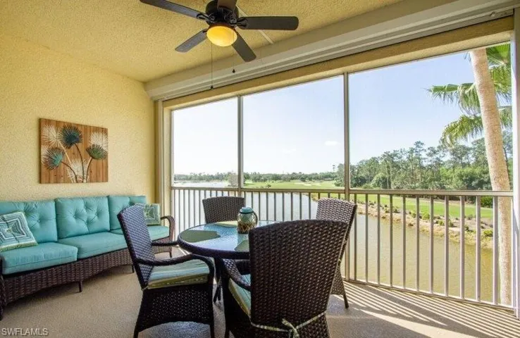 Sunroom / solarium with a water view