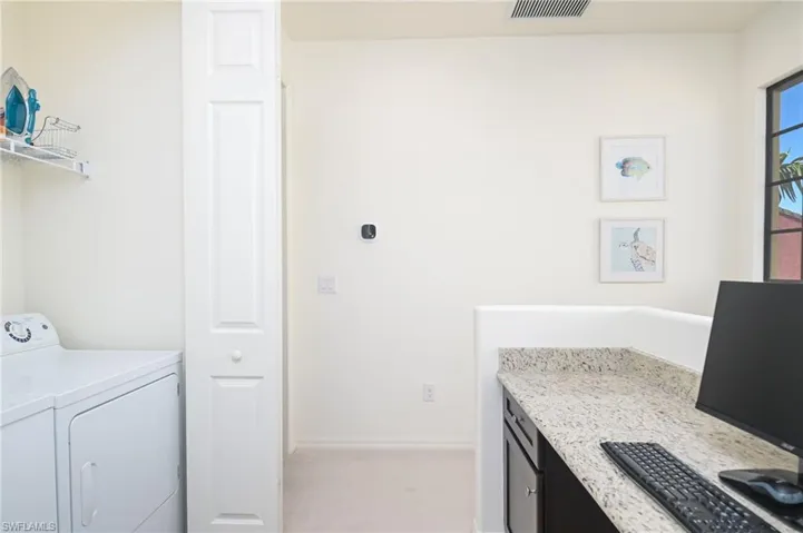 Washroom with washing machine and dryer