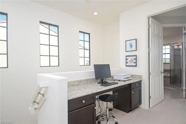 View of carpeted home office