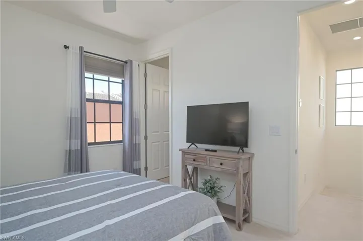 Bedroom with carpet flooring and ceiling fan
