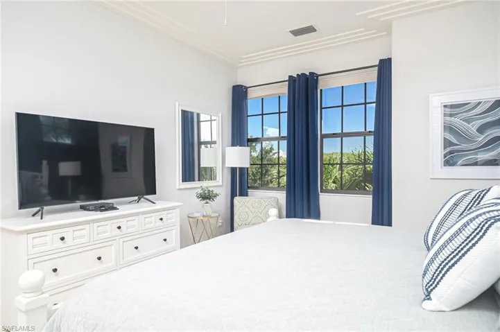 Bedroom featuring crown molding