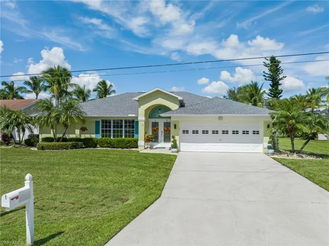 Ranch-style home with a garage and a front yard