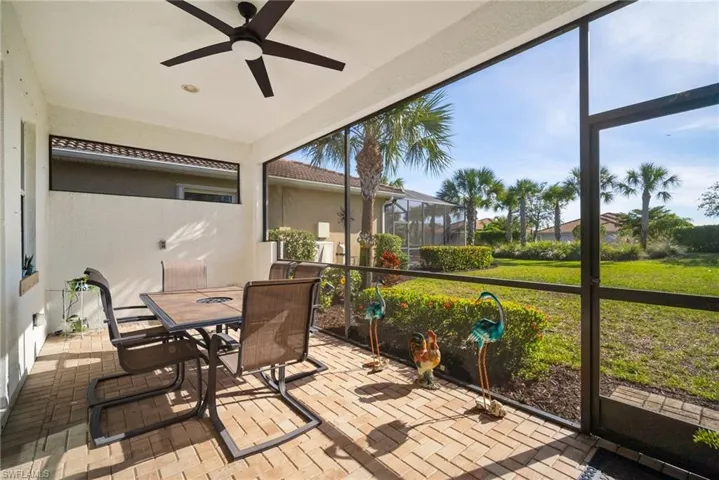 Sunroom / solarium featuring ceiling fan