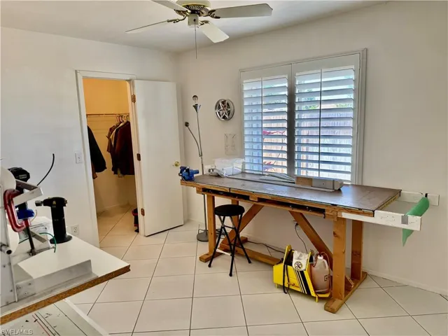 guest bedroom with plantation window coverings