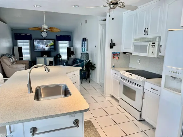 Light and bright kitchen open to the family room