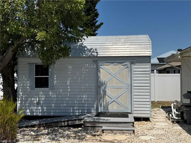 View of shed with fence