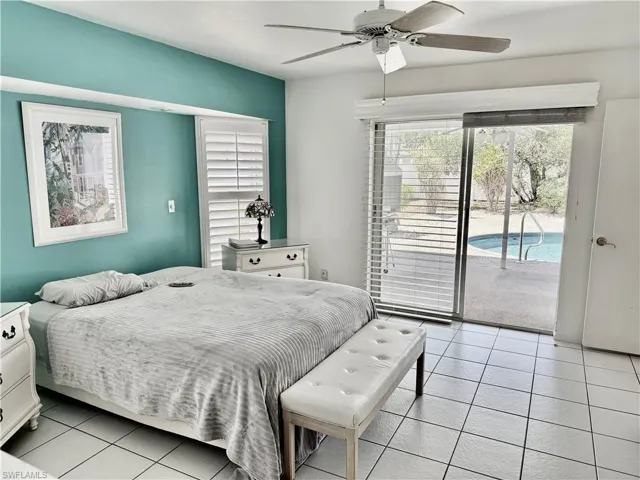 Main Bedroom featuring access to the lanai and pool area.