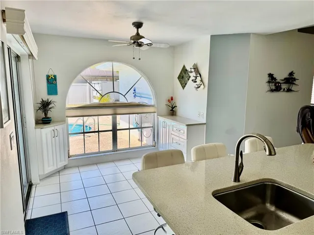 Informal dining area with view of the pool