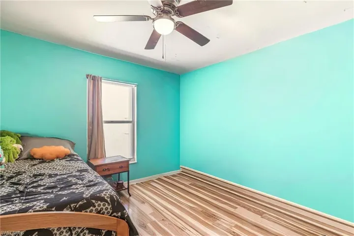 Bedroom featuring light wood finished floors and ceiling fan