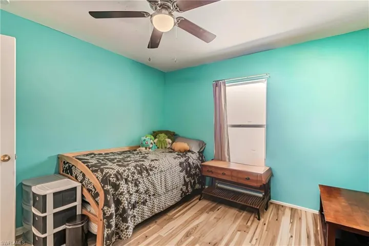 Bedroom featuring a ceiling fan and wood finished floors