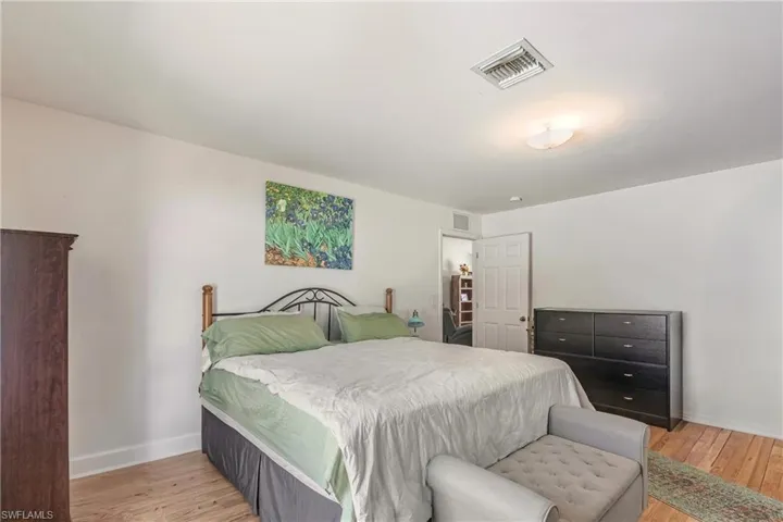 Bedroom featuring light wood-style floors and baseboards