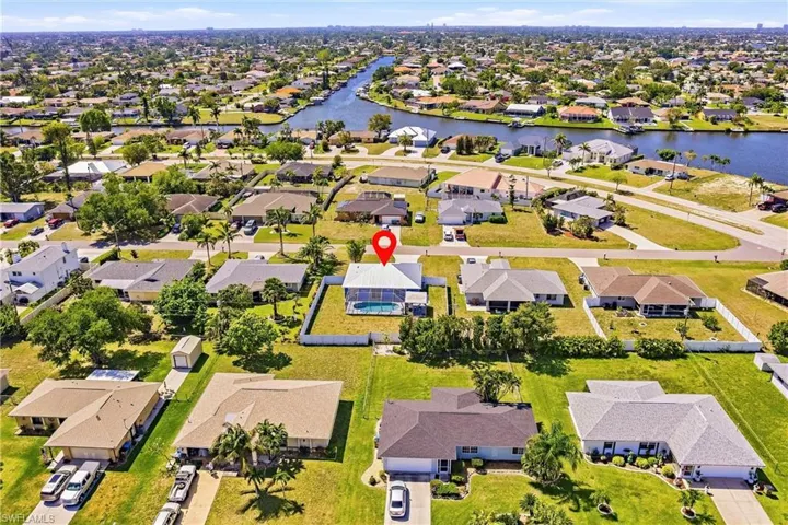 Aerial view of residential area with a nearby body of water