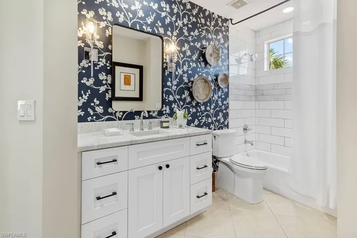 Guest Bathroom with pocket door into third bedroom