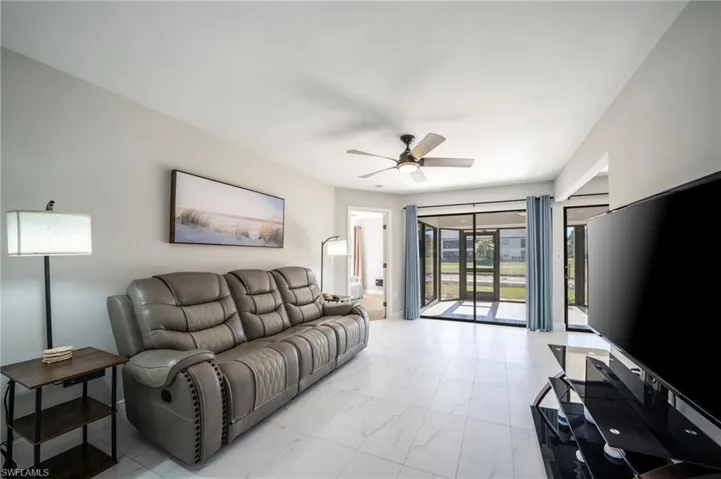 Living room featuring ceiling fan