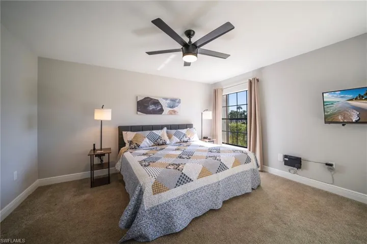 Bedroom with carpet floors and ceiling fan