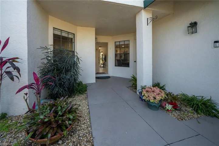 View of exterior entry featuring a patio area