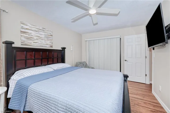 Bedroom featuring hardwood / wood-style flooring and ceiling fan