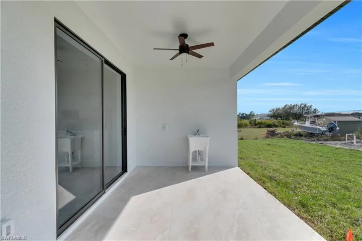 View of patio featuring a ceiling fan
