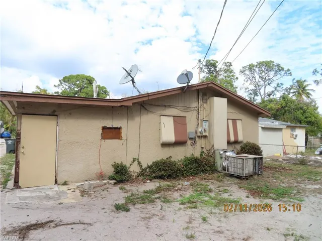 View of side of property featuring stucco siding