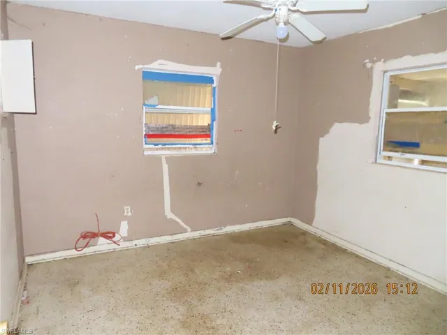 Unfurnished room featuring ceiling fan