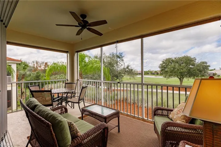 Sunroom / solarium featuring carpet and a baseboard radiator