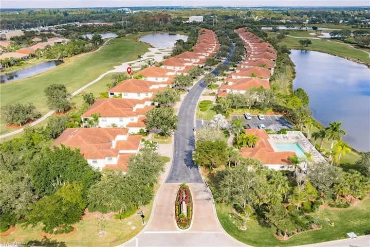 Aerial overview of property's location featuring a nearby body of water and nearby suburban area