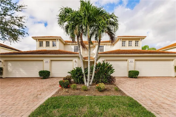 View of front of home featuring stucco siding, decorative driveway, a garage, and a tile roof
