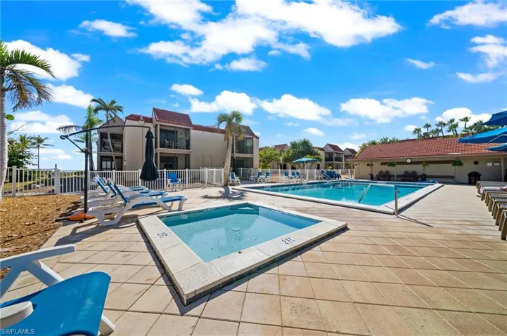 Community pool featuring a patio