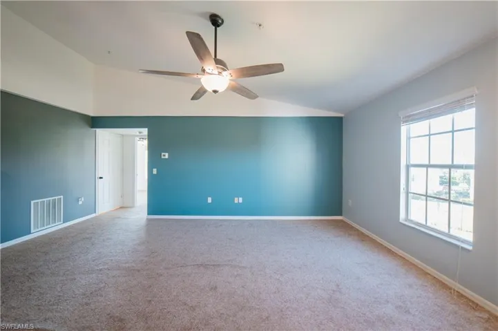 Large great room with view of water and vaulted ceilings