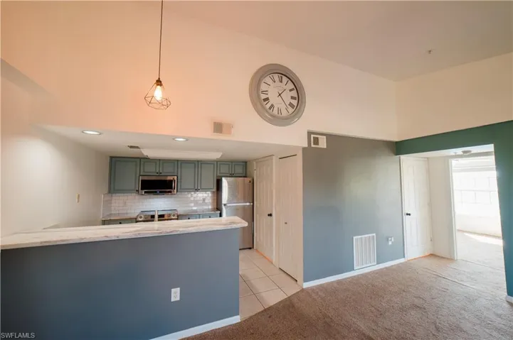 Updated Kitchen featuring stainless steel appliances and quartz countertops