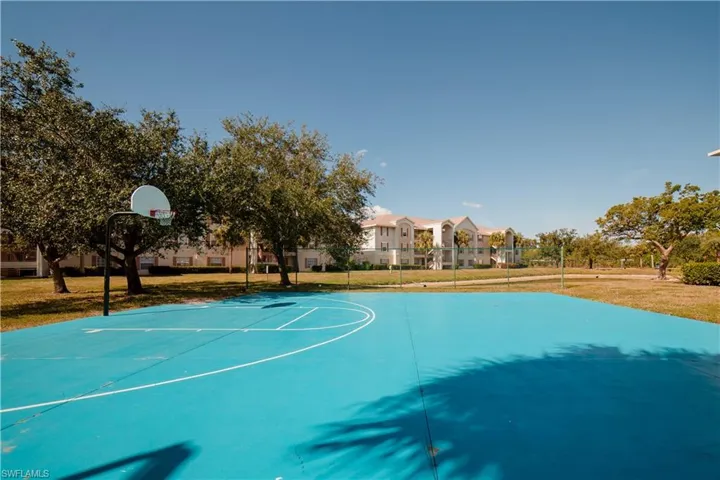 View of basketball court featuring community basketball court
