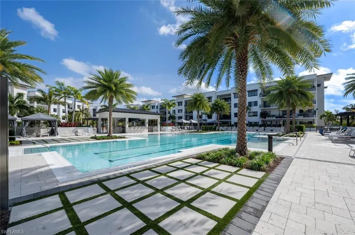Beautifully designed courtyard pool surrounded by lush tropical landscaping.