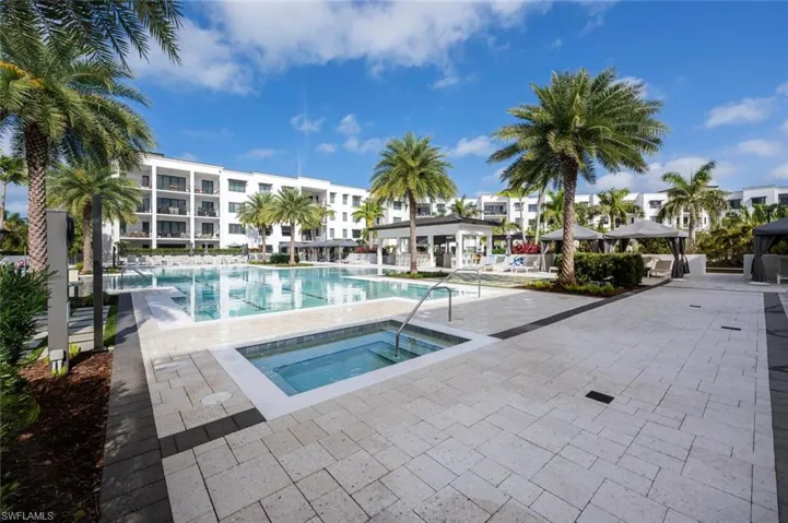 Resort-style pool with cabanas, lap lanes, and expansive sun deck.