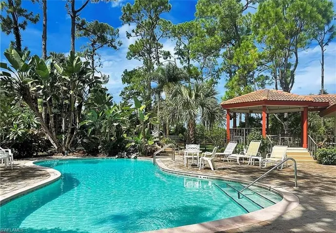 Community pool featuring a patio area and a gazebo