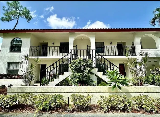 View of property with stairway