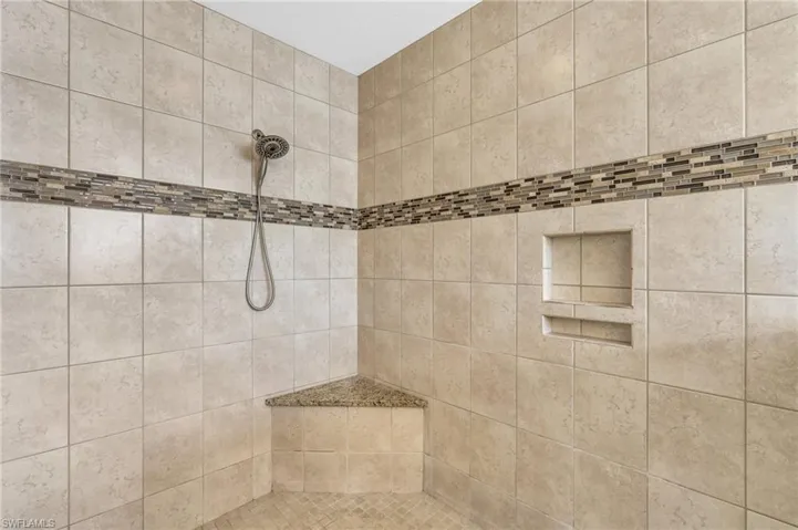 Bathroom featuring tiled shower