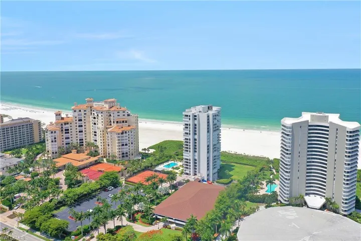 Bird's eye view featuring a water view and a view of the beach