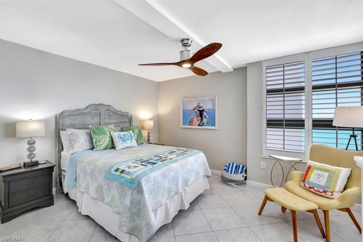 Tiled bedroom with ceiling fan
